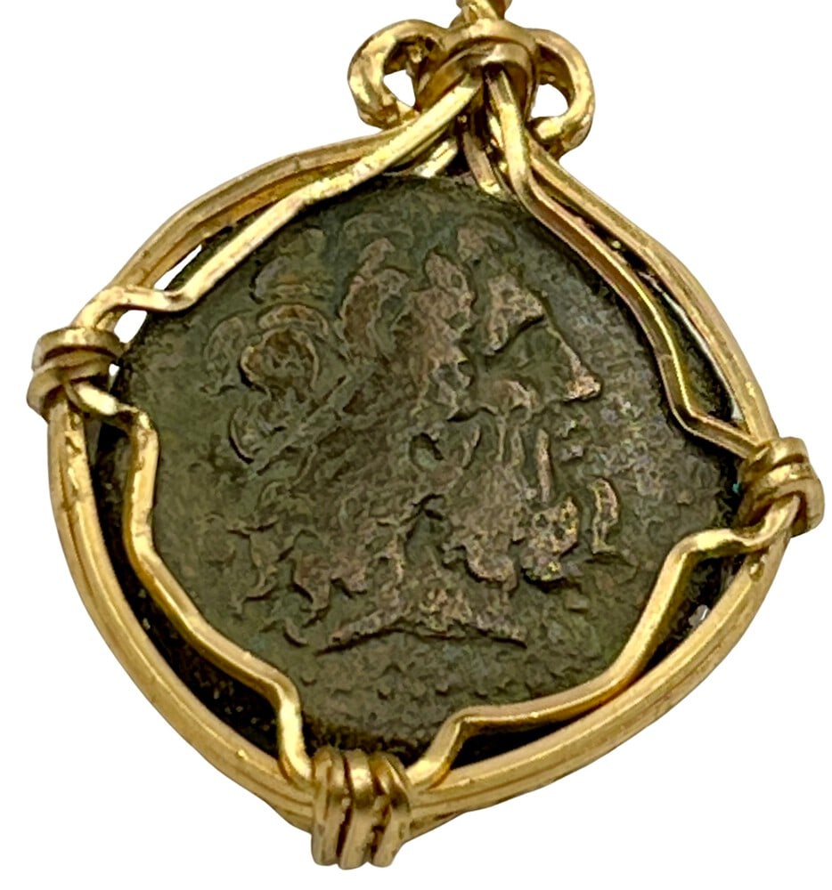 Ancient Poseidon and Zeus Grecian Coin: Greek Coin that features Poseidon and Zeus, expertly transformed into a stunning pendant necklace (#32).Genuine ancient bronze coin (circa 300 BCE).Beautifully mounted in a pendant setting,
