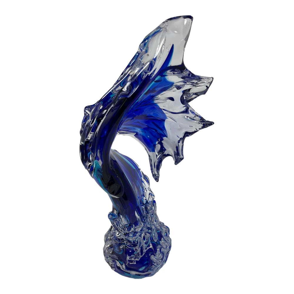 Contemporary Murano Glass Blue Wave Sculpture: Incredibly beautiful hand sculpted contemporary piece of Murano glass in the shape of a cresting wave. The perfect accent piece for any room. Measures 18 inches tall. Signed.
