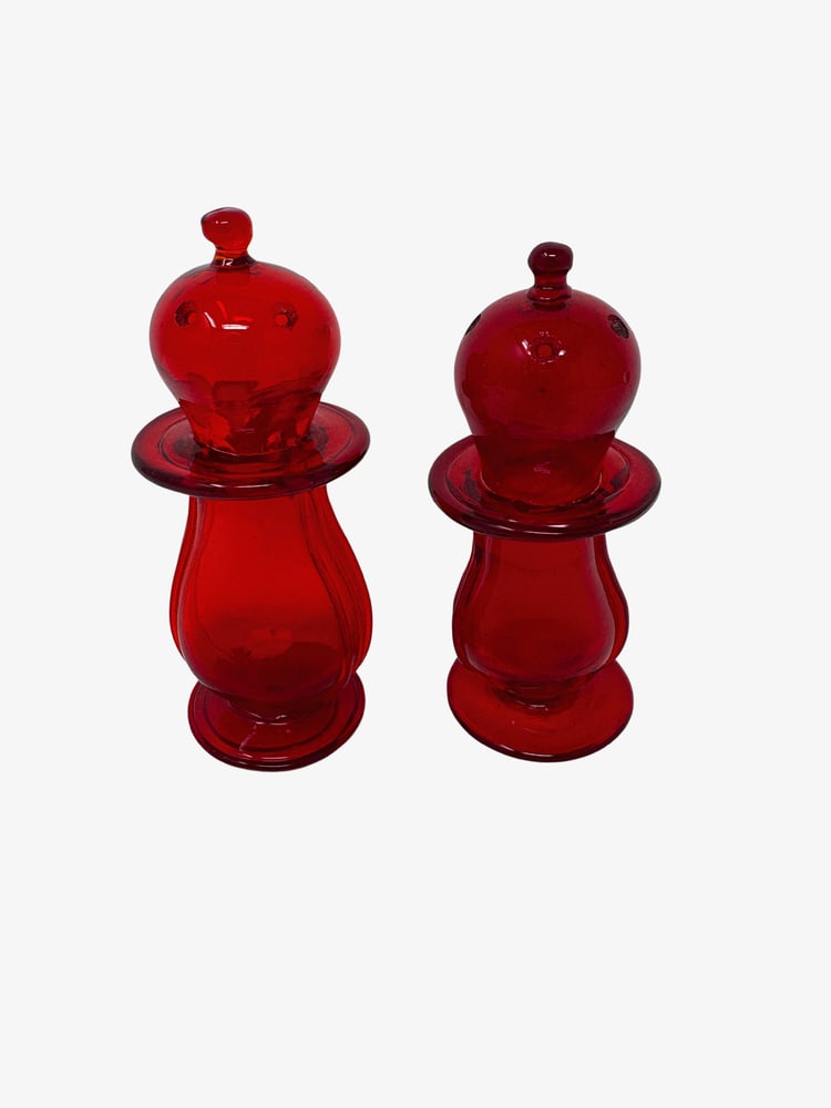 Murano Glass Vintage Ruby Red Salt and Pepper: Cute pair of Ruby Red salt and pepper shakers from Murano, Italy. A second pair is available upon request. Measure 4" tall.