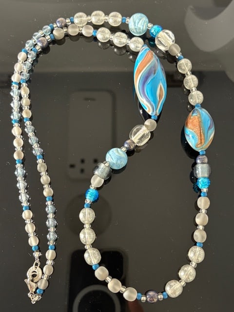 Murano Glass Necklace: Beautiful handmade necklace from the Artisans of Murano. Each bead is meticulously crafted and made into a wonderful and unique piece of jewelry. Measures 36".