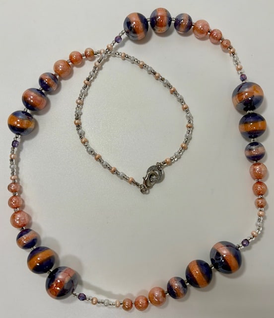 Murano Glass Necklace: Beautiful handmade necklace from the Artisans of Murano. Each bead is meticulously crafted and made into a wonderful and unique piece of jewelry. Measures 28".