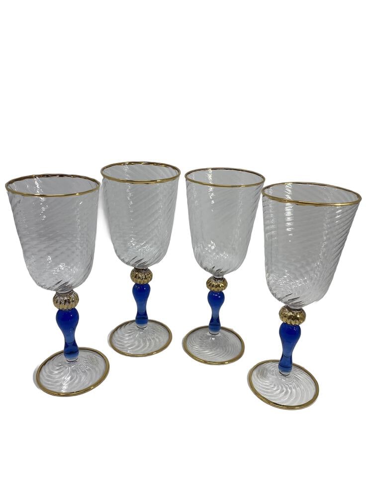 Murano Glass Wineglassesby Tessaro: Lovely set of 4 beautiful Wineglasses created by noted Glass Artisans Fratelli Tessaro. Great blue color with gold trim. Measures 7.5" tall.