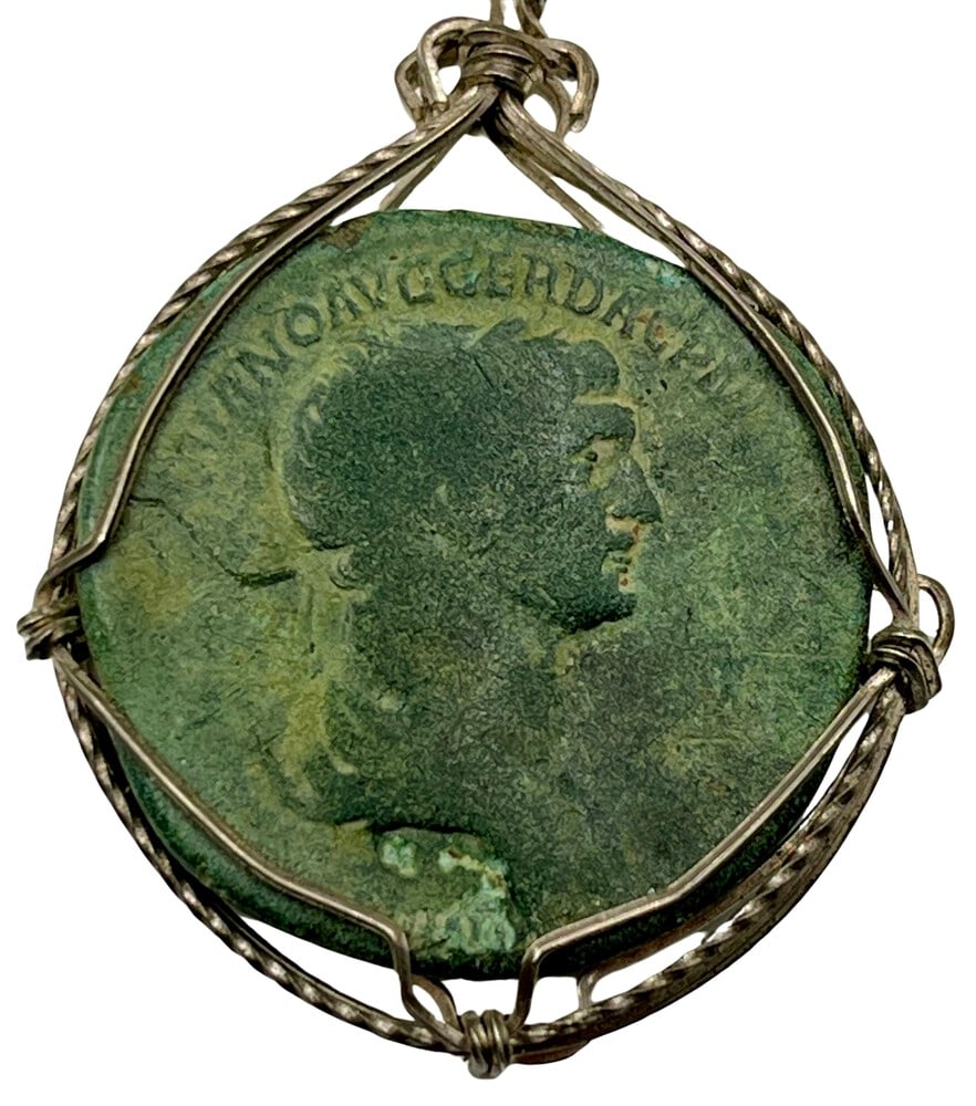 Roman Emperor Trajan Coin Pendant: Acquire a piece of ancient history with this genuine Roman coin, featuring Emperor Trajan, who built the Forum and Pax, masterfully converted into an exquisite pendant necklace. (#107)Highlights:- Aut