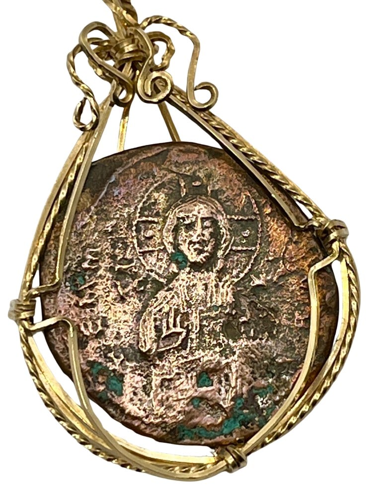 Fabulous Coin of Jesus Christ Pendant: One of the finest examples we've seen! Acquire a fragment of ancient history with this genuine bronze coin, the earliest known to bear the likeness of Jesus Christ, masterfully converted into an