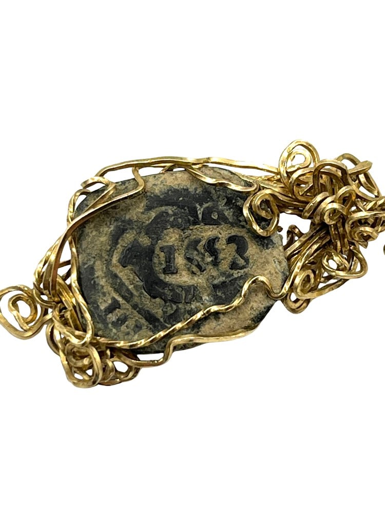 Spanish Shipwreck Coin Dated 1653 on Pendant: Rare Dated 8-Reale Spanish Shipwreck Coin Made into a Pendant-A Piece of HistoryOwn a piece of ancient history with this authentic coin, expertly transformed into a stunning pendant. (#419)Genuine