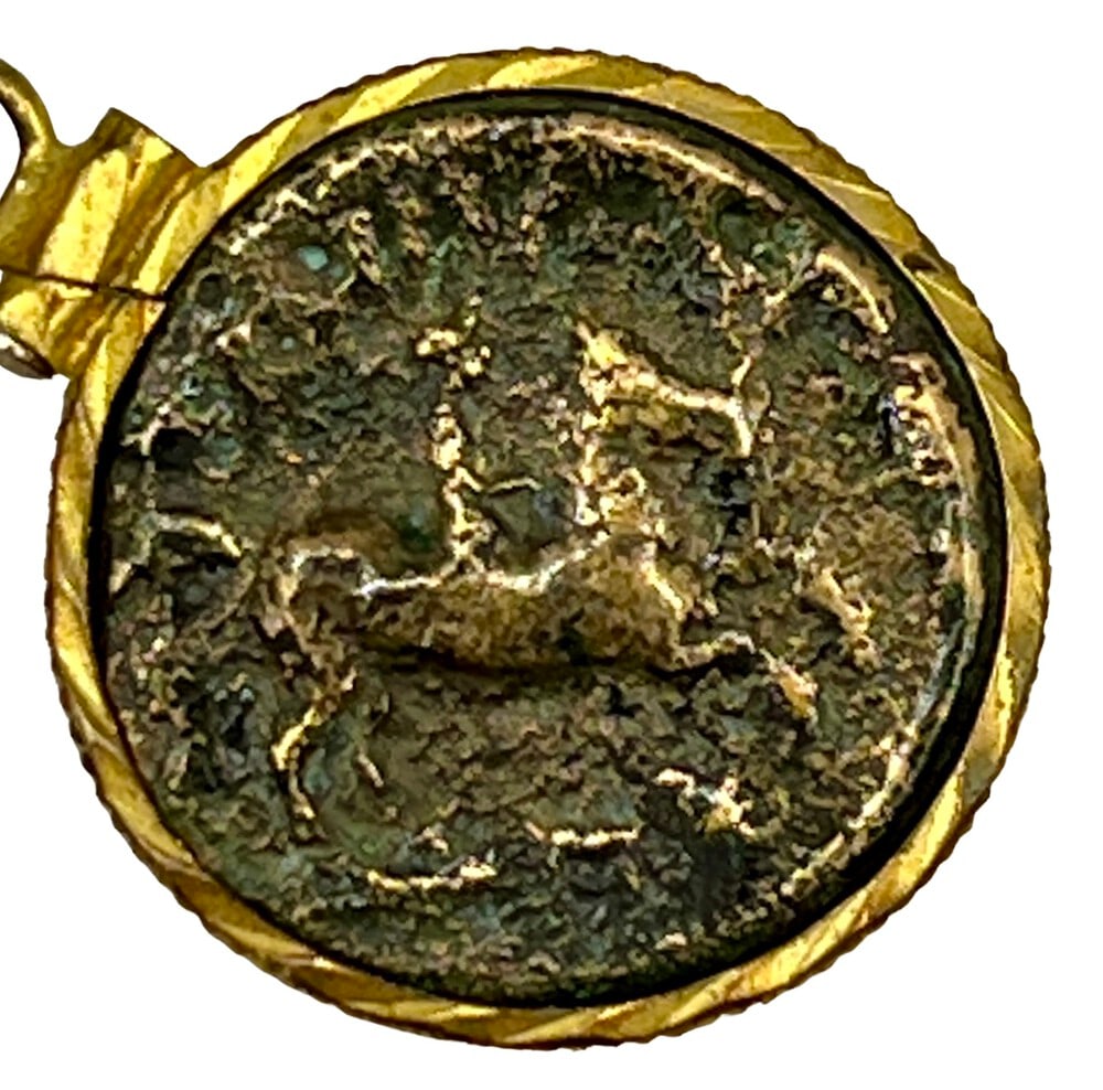 King Phillip Olympic Coin Necklace: King Phillip, Father of Alexander the Great, bronze coin expertly transformed into a stunning pendant necklace. Features Equestrian rider on reverse, honoring the King's participation in the Ancient