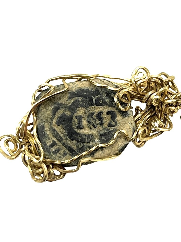 Spanish Shipwreck Coin Dated 1653 on Pendant: Rare Dated 8-Reale Spanish Shipwreck Coin Made into a Pendant-A Piece of HistoryOwn a piece of ancient history with this authentic coin, expertly transformed into a stunning pendant. (#419)Genuine anc