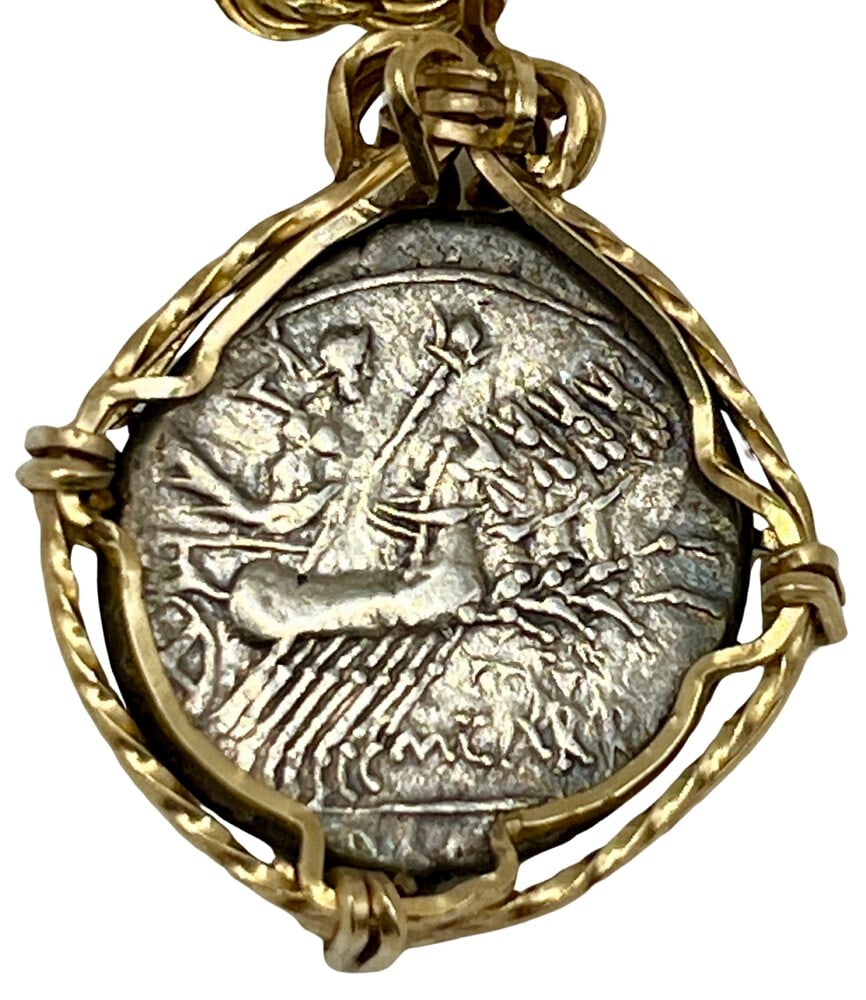 Ancient Roman Gladiator and Chariot Coin Necklace: Roman Gladiator and Chariot, authentic silver coin, expertly transformed into a stunning pendant necklace. (#146)Genuine ancient silver coin (circa 110 BCE).Beautifully mounted in a pendant setting,