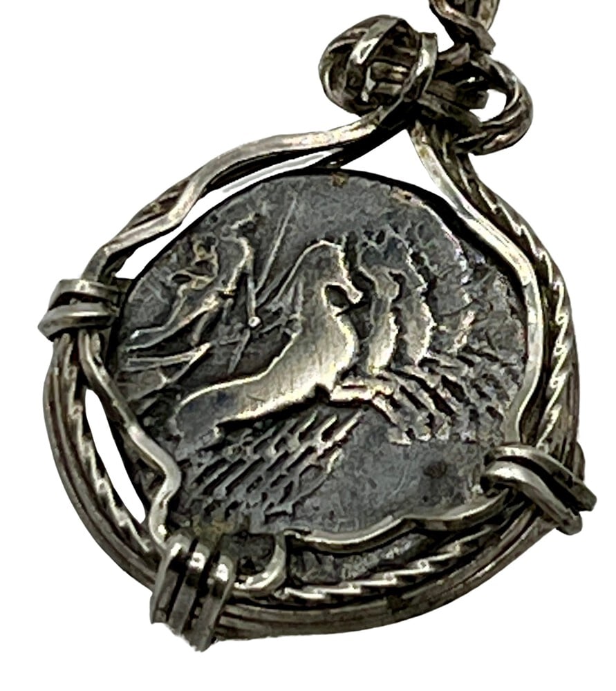 Roman Chariot Ancient Coin: Acquire a piece of ancient history with this genuine silver coin, featuring a Roman Chariot and Gladiator, masterfully converted into an exquisite pendant necklace. A very rare and significant piece o