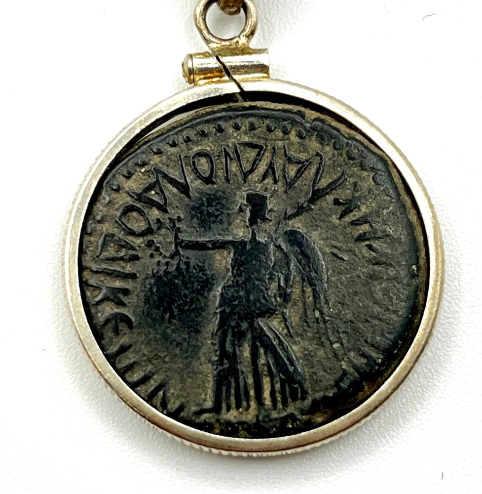 Angel and Emperor Vespasian Roman Coin: Ancient Coin of Emperor Vespasian Pendant-A Piece of History. Own a piece of ancient history with this authentic bronze coin, expertly transformed into a stunning pendant. (#406). Genuine ancient