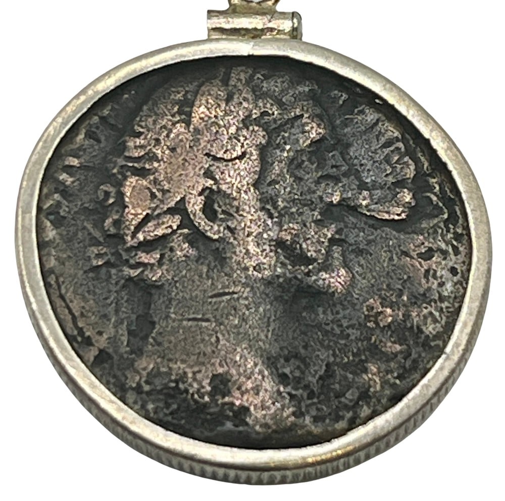 Emperor Pius, the Good Emperor Coin: Acquire a piece of ancient history with this genuine bronze coin, featuring Emperor Pius (the Good Emperor), masterfully converted into an exquisite pendant necklace. A very rare and significant piece