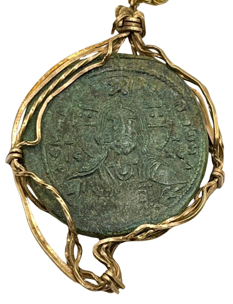 1,000 Year Old Jesus Coin: Acquire a fragment of ancient history with this genuine bronze coin, the earliest known to bear the likeness of Jesus Christ, masterfully converted into an exquisite pendant necklace. (#409). -
