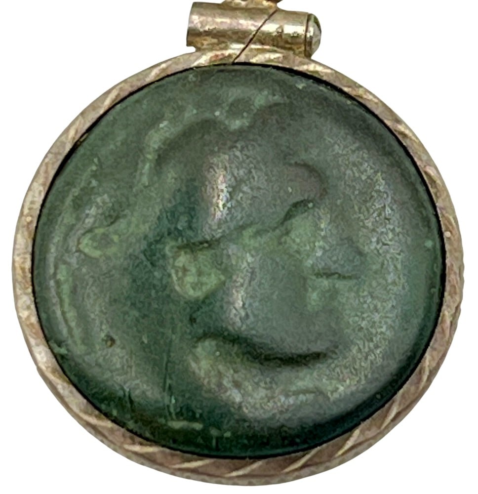 Alexander the Great, 320 BCE: Alexander the Great authentic bronze coin, expertly transformed into a stunning pendant necklace. (#190). Genuine ancient bronze coin (circa 320 BCE). Beautifully mounted in a pendant setting,