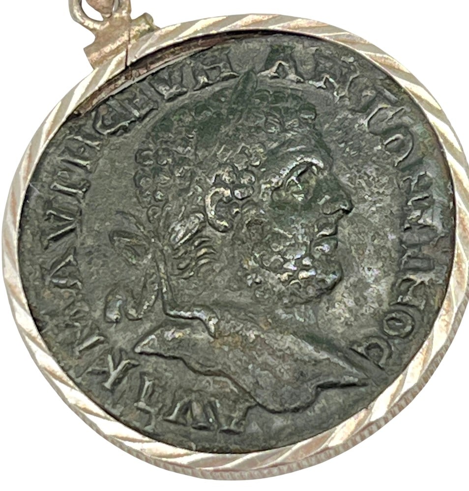 Roman Emperor Caracalla Coin: Roman Emperor Caracalla authentic bronze coin, expertly transformed into a stunning pendant necklace. (#1).Genuine ancient bronze coin (circa 200 AD). Beautifully mounted in a pendant setting, showcas