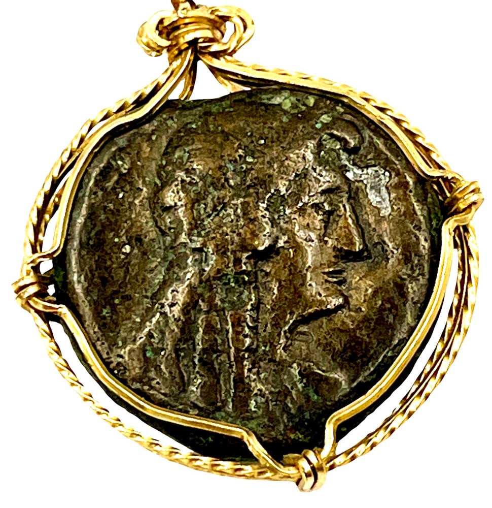 Ancient Cleopatra Coin 100 BCE: Cleopatra and Zeus authentic bronze coin, expertly transformed into a stunning pendant. (#384). Genuine ancient bronze coin (circa 100 BCE). Beautifully mounted in a pendant setting, showcasing the co
