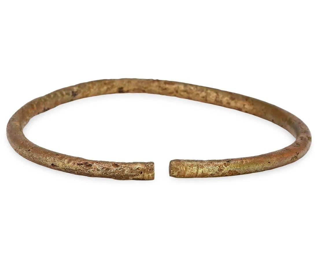 Authentic Ancient Medieval Viking / Celtic / Livonian Bronze Bracelet Armlet, 11th-13th Century: An authentic ancient medieval Viking Celtic bronze bracelet is a remarkable artifact that offers a window into the craftsmanship and culture of the time. This type of bracelet, often adorned with intr