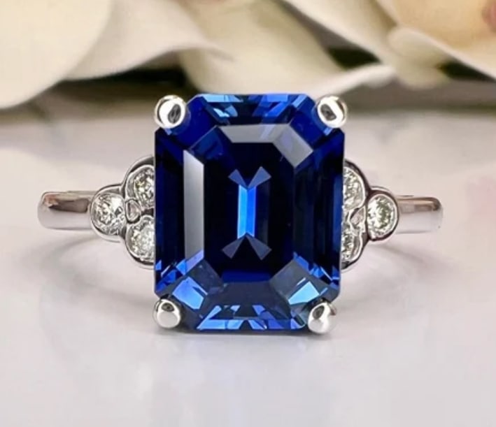 Certified 6.5 Carat Emerald cut Lab Grown Blue Sapphire Engagement Ring 14KT Solid White Gold: Certified 6.5 Carat Emerald cut Lab Grown Blue Sapphire Engagement Ring 14KT Solid White Gold - Ring Size US -6 Side stone 0.50 Ct Lab Grown Diamonds Round VS1 E Color