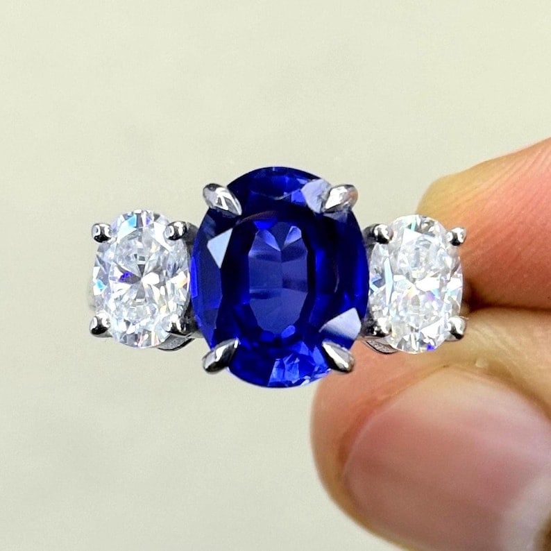 Certified 5 Carat Oval Cut Lab Grown Blue Sapphire Engagement Ring 14KT Solid White Gold: Certified 5 Carat Oval Cut Lab Grown Blue Sapphire Engagement Ring 14KT Solid White Gold - Ring Size US - 7 Side stone 2.00 Ct Lab Grown Diamonds Oval VS1 E Color