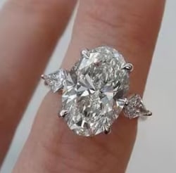 Certified 8.5 Ct Oval Cut D VVS1 Lab Grown Diamond 14k Solid White Gold Engagement Ring: Certified 8.5 Ct Oval Cut D VVS1 Lab Grown Diamond 14k Solid White Gold Engagement Ring - Side Stones: 0.60 Ct – Fancy Cut Lab Grown Diamonds Side Stone Quality: D Color, VS1 Clarity Metal: 14K Soli