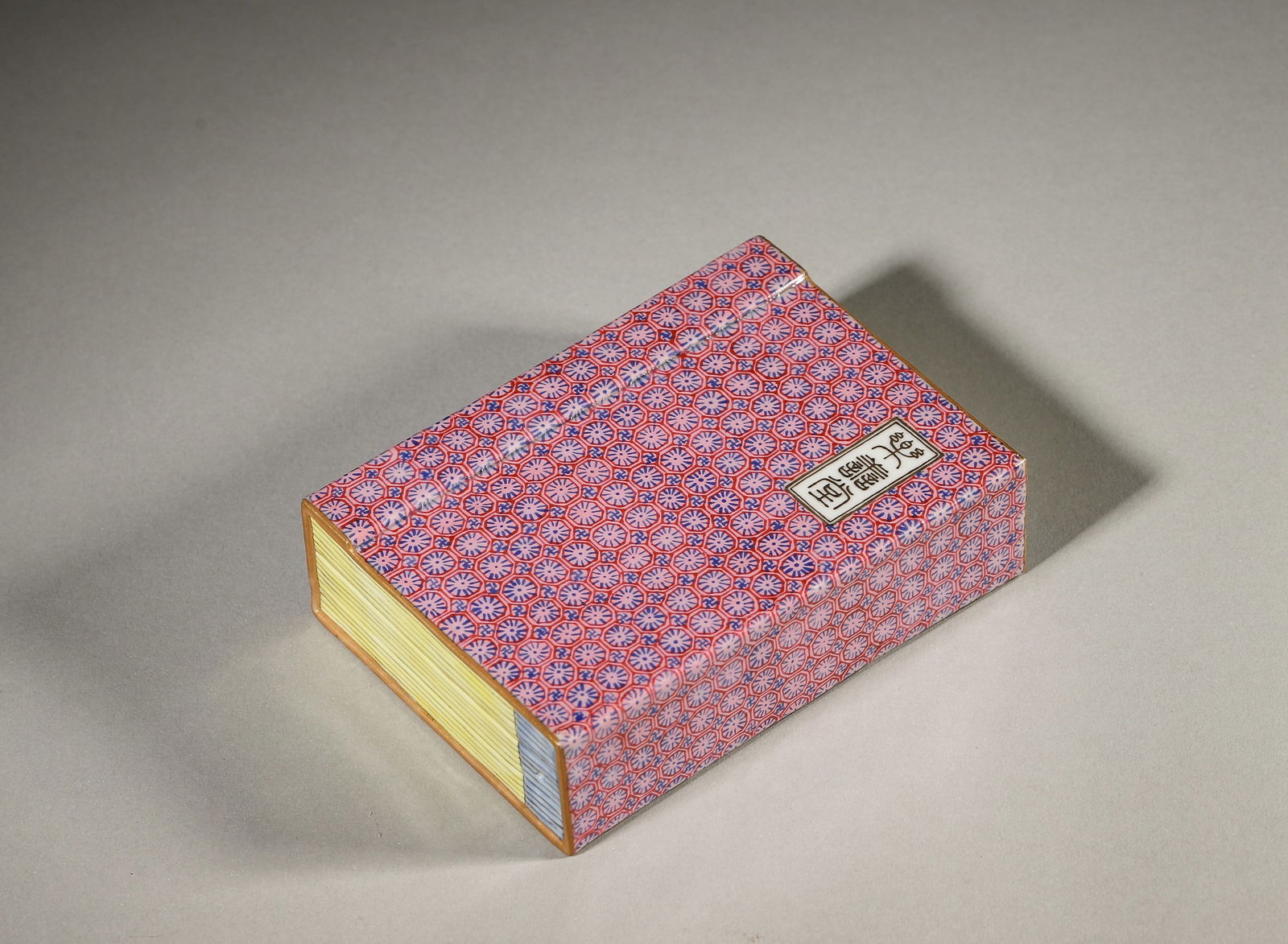 A famille rose flower porcelain book shaped paperweight,Qing Dynasty,China: L:11cm W:7.8cm H:3cm