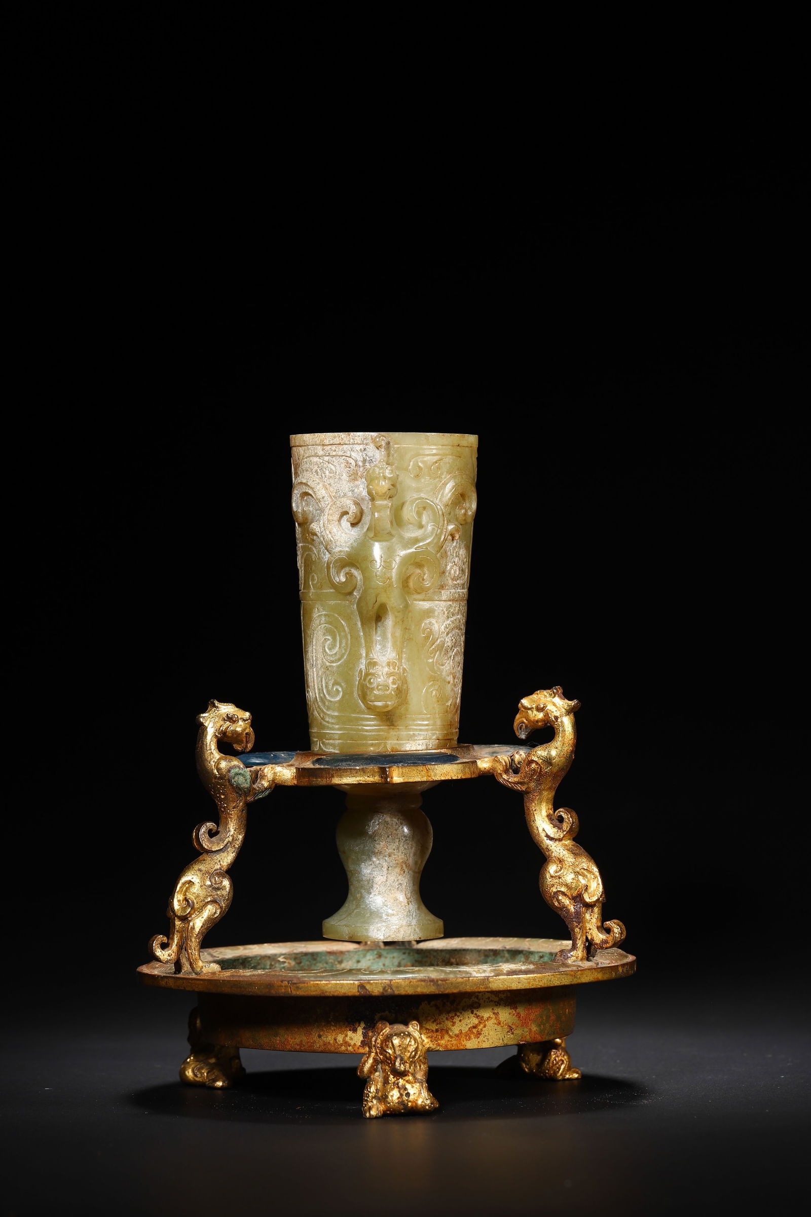 Han Dynasty Gilt Glazed-Light & Jade Cup Stand: Diameter 12.0cm (4.72in), Height 16.0cm (6.3in), Weight 782.0g (1.72lb)Hetian jade ring with relief coiled chi-dragon patterns, paired with a gilded bronze tray (inlaid with sapphires, decorated with