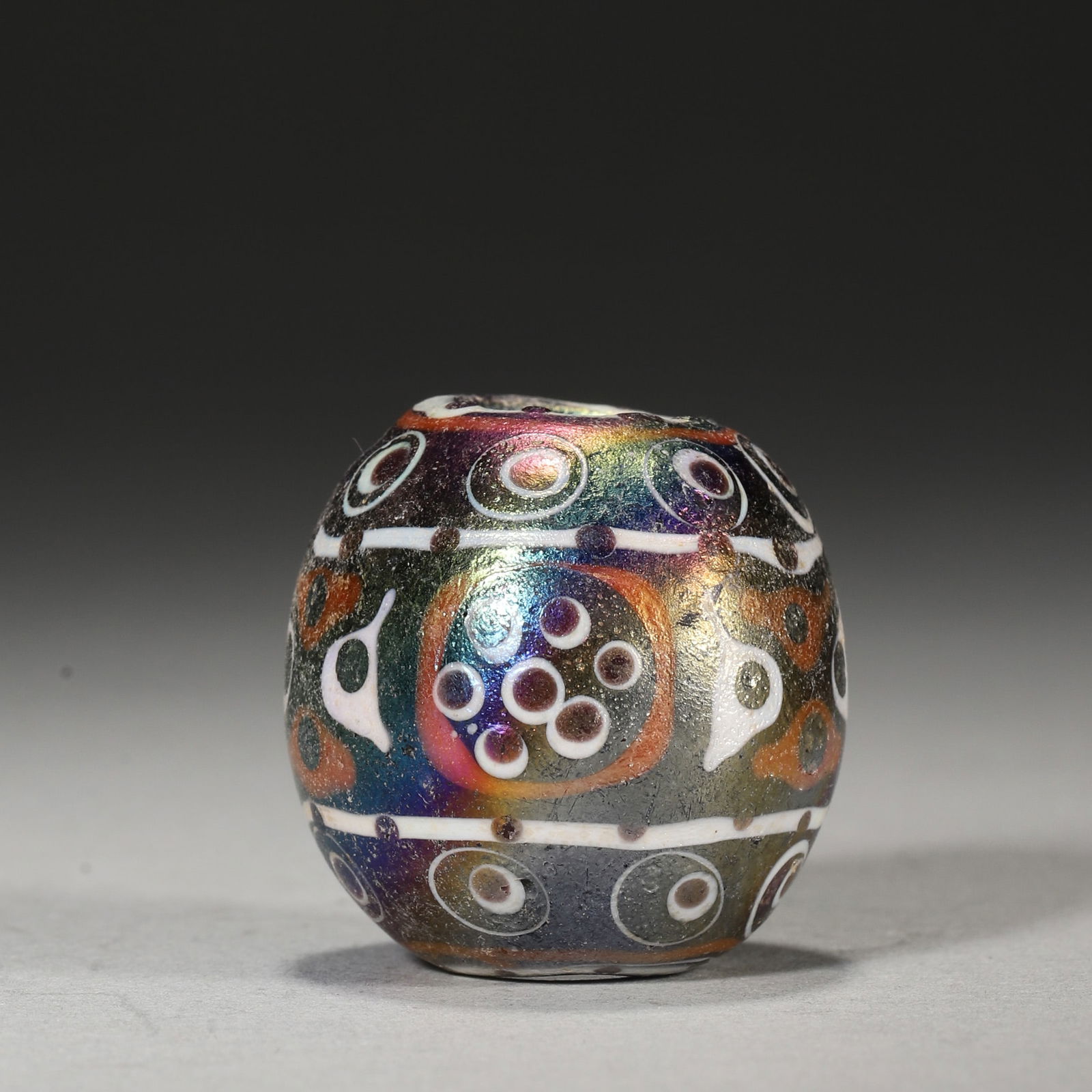 Late Warring States Period Multi-eyed Dragonfly Eye Glass Bead: Diameter 3cm Weight 38g,Diameter 1" Weight 0.08lbsLead-barium glass bead (Warring States): multi-layer spiral pattern (red/white, "moonlight" effect from p â te-de-verre). Early East-West cultural ex