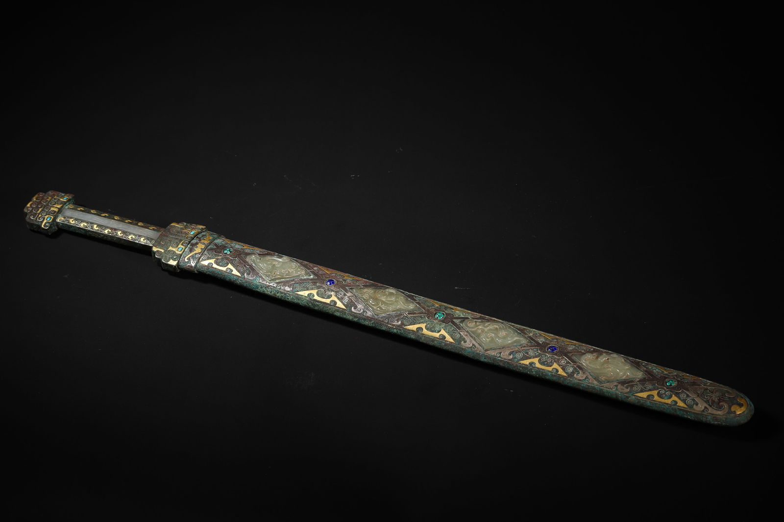 Warring States Period Jade-Hilted Gold-and-Silver-Inlaid Gemstone Sword: Length 54.5cm (21.46in), Width 4.0cm (1.57in), Weight 958.0g (2.11lb)c. 475-221 BCE. Sword Blade with Cuo-Jin & Silver Auspicious Beast Patterns; Handle & Guard Inlaid with Carved Hetian Jade. Combine