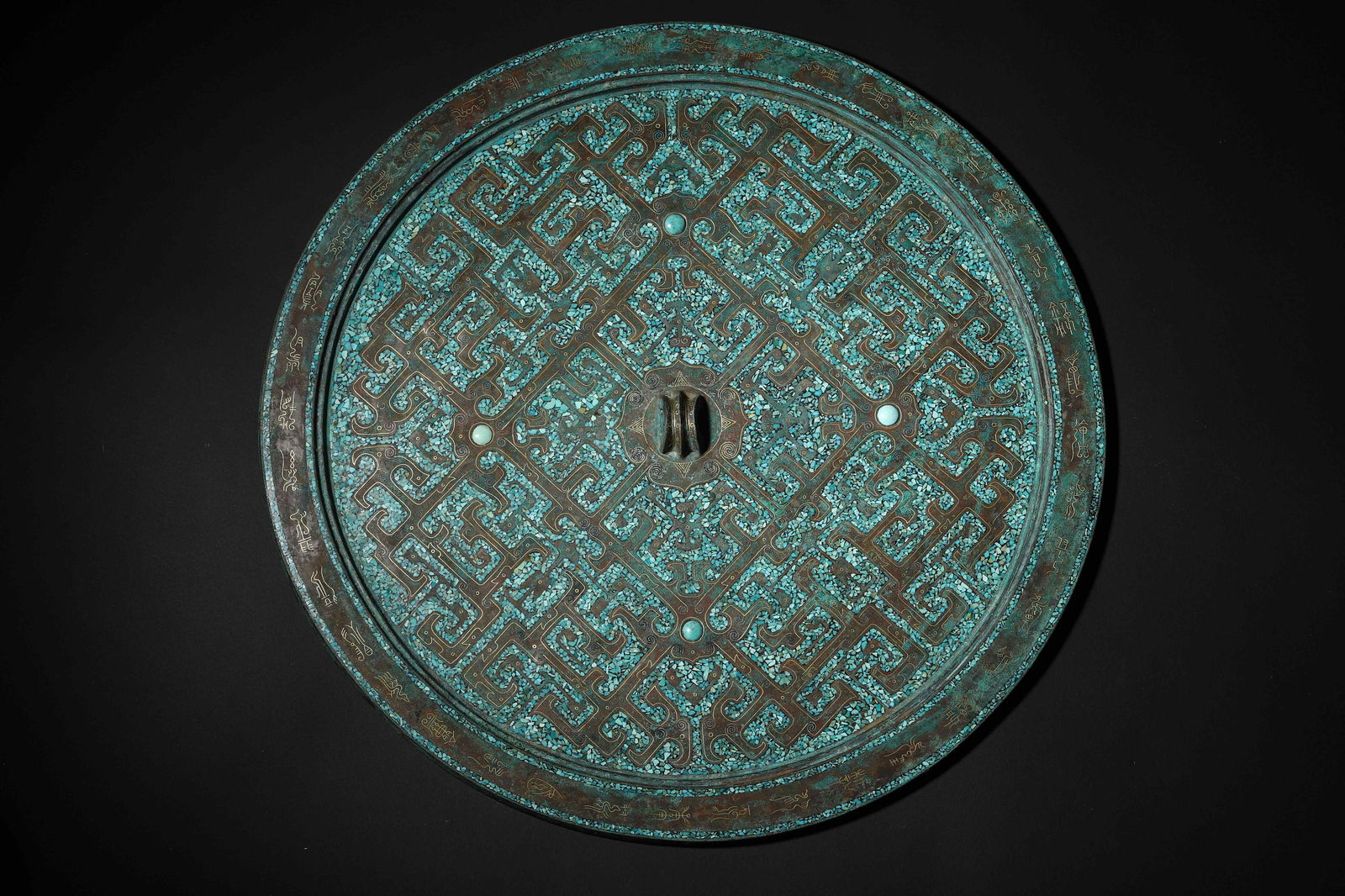 Warring States Period Turquoise-Inlaid Coiled Dragon-Pattern Bronze Mirror: Diameter 34.5cm (13.58in), Weight 3442.0g (7.59lb)c. 475-221 BCE. Bronze Back Fully Inlaid with Turquoise Coiled Dragon Patterns, Separated by Beads. Neat Patterns & Exquisite Craftsmanship. A Rare Ex