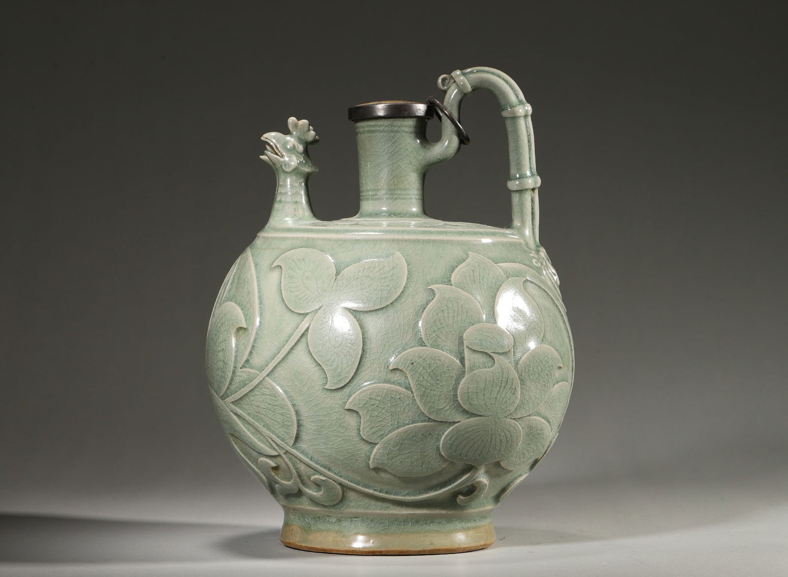 Song Dynasty Yaozhou Kiln Celadon Ewer with Lotus Carving & Phoenix Spout: D: 18.0cm (7.09"); Height: 24.0cm (9.45")A fine Yaozhou celadon ewer from Song Dynasty, featuring crackled glaze, vivid carved lotus motifs, and a rare phoenix-shaped spout. It represents the apex of