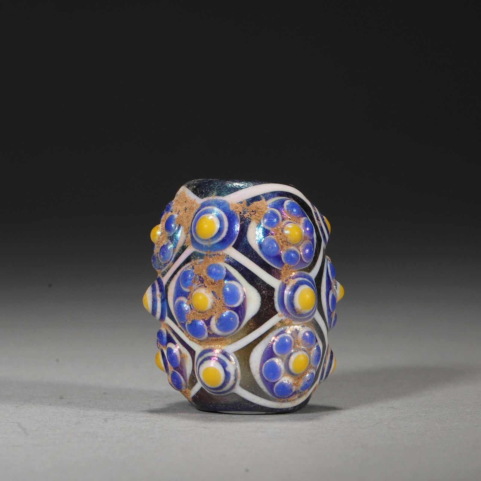 Late Warring States Period Multi-cluster Dragonfly Eye Glass Bead: Diameter 3cm Length 3.5cm Weight 34g,Diameter 1" Length 1" Weight 0.07lbsLead-barium glass bead (Warring States): multi-zone spiral pattern (yellow/white/blue/red, "layered flowering" effect —