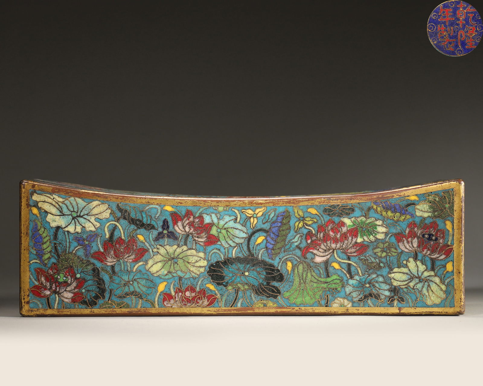 Qing Dynasty, Qianlong Imperial-Made, Cloisonné Enamel on Copper Pillow with Lotus Pond and: Length 29.0cm (11.42in), Width 12.0cm (4.72in), Height 9.0cm (3.54in), Weight 1808.0g (3.99lb)Copper body with gilding, peacock blue background fully decorated with lotus pond, mandarin ducks and lotu