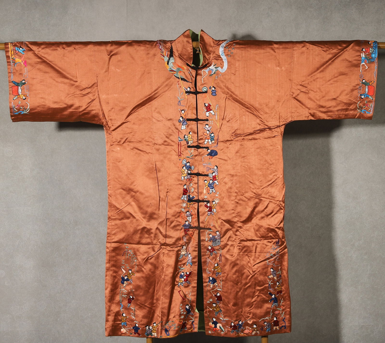 Early 20th-Century Orange Satin Robe with Embroidery of “One Hundred Boys: Length: 120.0cm (47.24"); Height: 98.0cm (38.58")Early 20th-century orange satin robe, fully embroidered with colorful “one hundred boys” motifs in fine stitches, plus cloud-dragon patterns. I