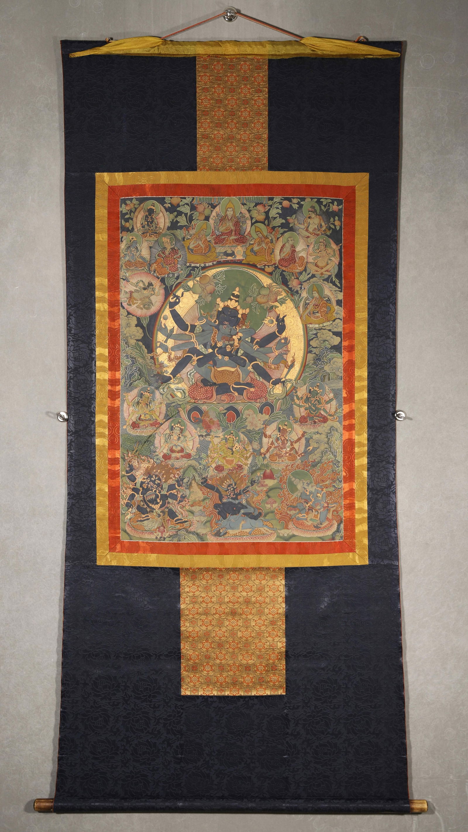 18th Century Tibetan Thangka of Guhyasamaja (Secret Assembly): Length 75cm Width 49cm (Length 29.53" Width 19.29")18th-century Secret Guhyagarbha Vajra thangka: wrathful multi-armed deity (with retinue); bold, precise mineral pigments; powerful ritual style. Gold