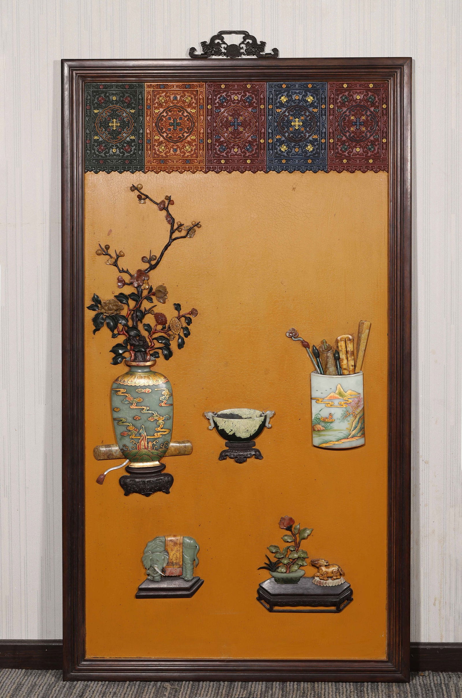 A Zitanwood Framed Hanging Screen with Yellow Lacquer Ground and Hundred Treasures Inlay "Antiques",: Length (L): 111.0cm (43.7in); Width (W): 62.0cm (24.41in)This imperial hanging screen, made during the Qianlong period, features a zitanwood frame, yellow lacquer ground inlaid with precious stones
