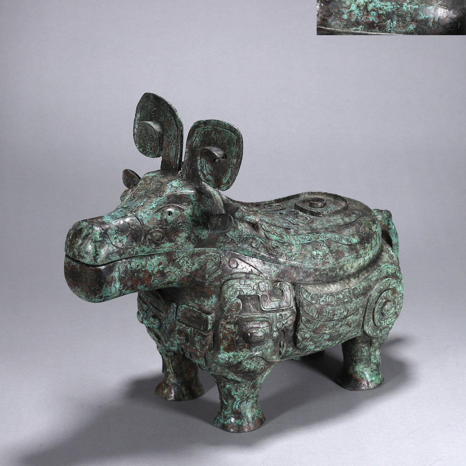 AN IMPORTANT ARCHAIC BRONZE OX-FORM RITUAL VESSEL (GONG), EARLY WESTERN ZHOU DYNASTY (1 of 9)
