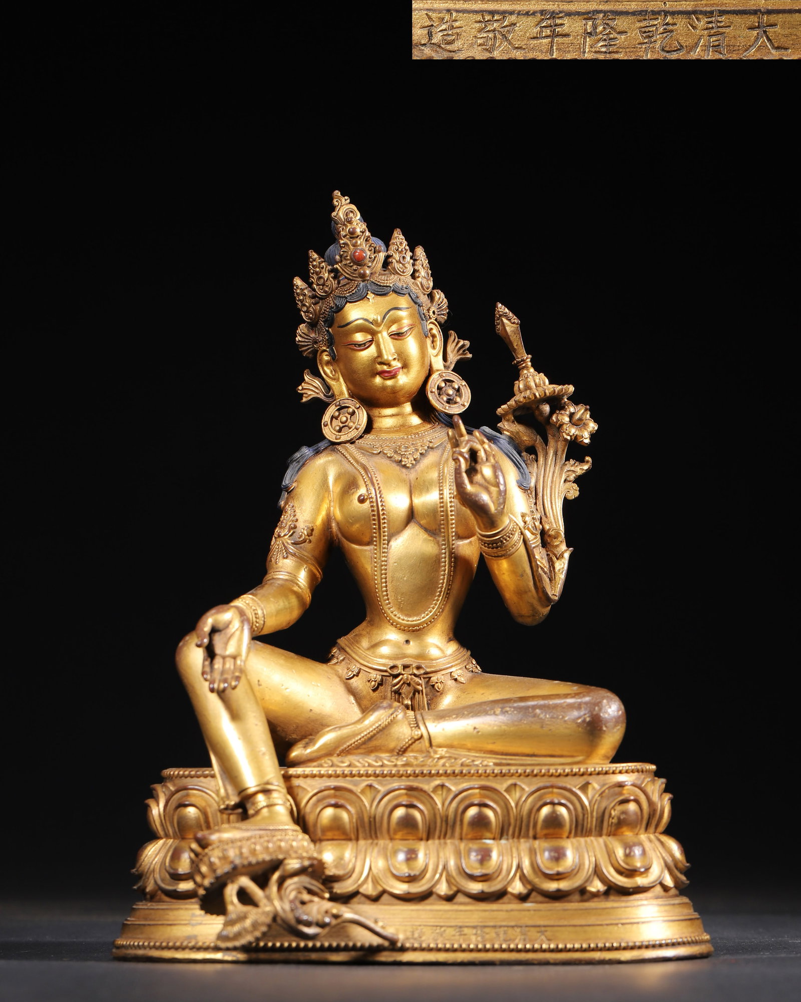 A GILT-BRONZE FIGURE OF GREEN TARA, IMPERIAL MADE IN THE QIANLONG PERIOD OF THE QING DYNASTY: 5.91" x 5.12" x 8.27" inches (15.0 cm x 13.0 cm x 21.0 cm) | Weight: 3.99 lbs (1810.0 g)This exquisite Green Tara, crafted by the imperial workshop during the Qianlong reign, is a masterpiece of Sino-