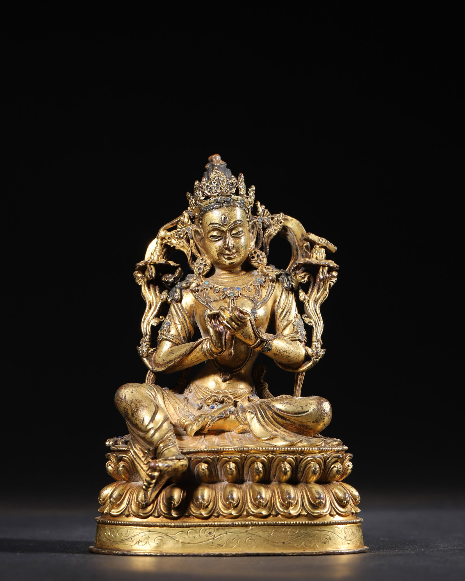 COMMISSIONED GILT-BRONZE FIGURE OF MANJUSHRI, MING DYNASTY, YONGLE PERIOD: 3.74" x 3.54" x 5.51" inches (9.5 cm x 9.0 cm x 14.0 cm) (Main) | Weight: 1.47 lbs (666.0 g)Provenance: Formerly part of the judicial liquidation estate of Ming Pierre, France (1932), and later acquir