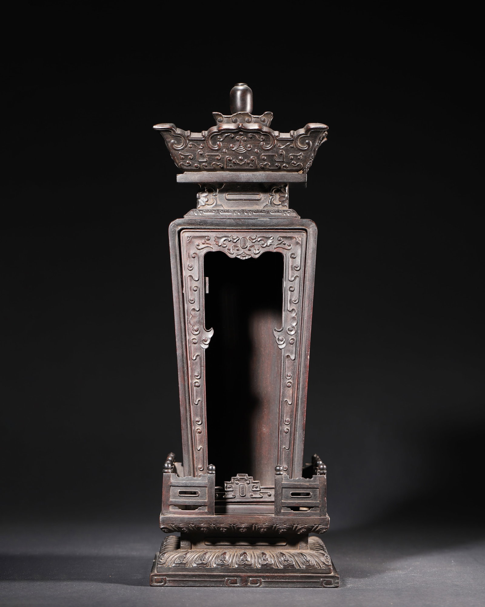 A ZITAN WOOD CARVED BUDDHIST SHRINE, QIANLONG PERIOD, QING DYNASTY: 5.88" x 5.88" x 16.12" (15.0cm x 15.0cm x 41.0cm) | 3.79lbThis Buddhist shrine is carved from zitan wood, featuring a regular form and exquisite carving. Inscribed with the 25th year of Qianlong
