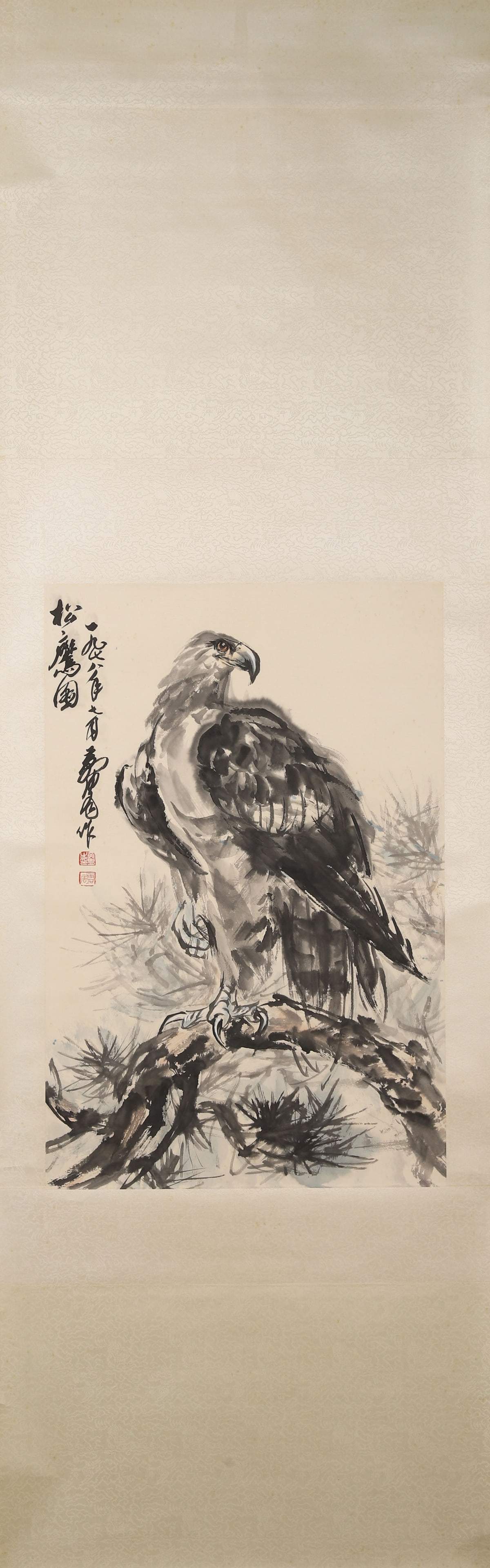 CONTEMPORARY, 1988: HUANG ZHOU, "PINE AND EAGLE" HANGING SCROLL: Paper Texture, 29.92 inches x 15.75 inches (76.0 cm x 40.0 cm)A 1988 masterpiece by Huang Zhou, depicting a powerful eagle on a pine branch with bold brushwork, blending Chinese and Western