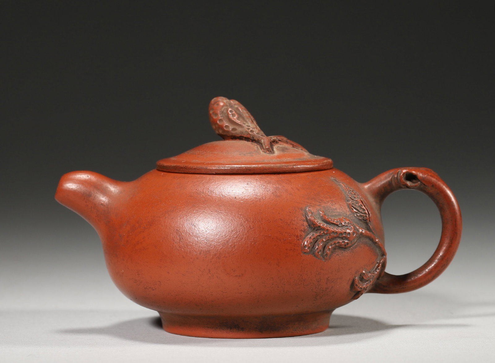 A QING PERIOD ZHUNI CLAY TEAPOT WITH BUDDHA'S HAND AND LOTUS SEED POD APPLIQUÉS (1 of 7)
