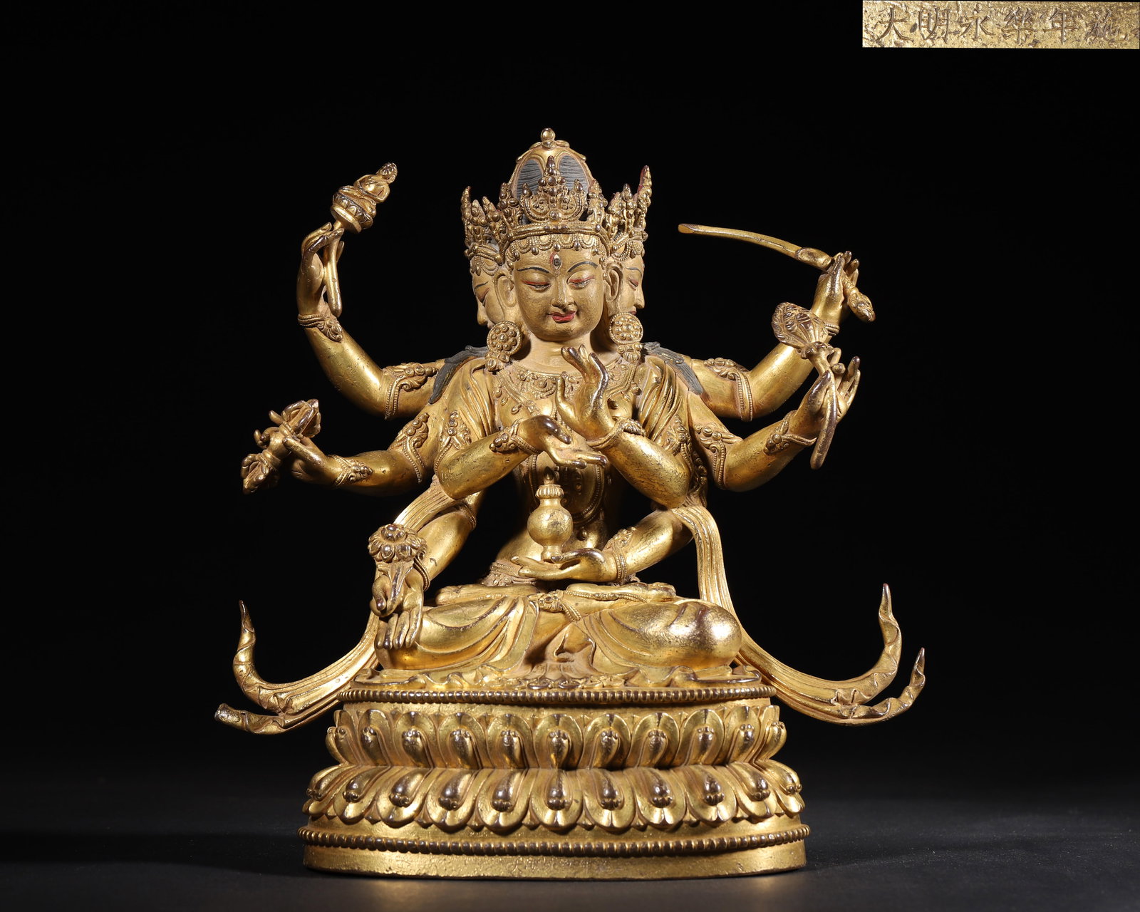 IMPERIAL COMMISSIONED GILT-BRONZE FIGURE OF EIGHT-ARMED THREE-EYED BUDDHA MOTHER, MING DYNASTY,: 7.87"x 3.94" x 9.06" inches (20.0 cm x 10.0 cm x 23.0 cm) (Main) | Weight: 5.37 lbs (2437 g)A fine imperial gilt-bronze figure of Eight-Armed Three-Eyed Buddha Mother, Yongle period, Ming Dynasty. Exq