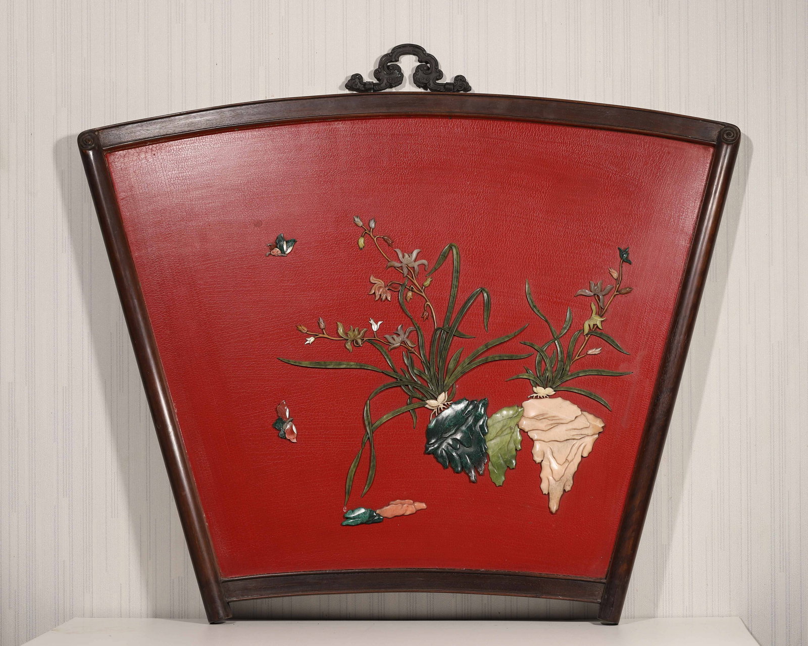 A ZITAN WOOD AND RED LACQUER FAN-SHAPED WALL SCREEN INLAID WITH GEMSTONES, QIANLONG PERIOD, QING (1 of 7)