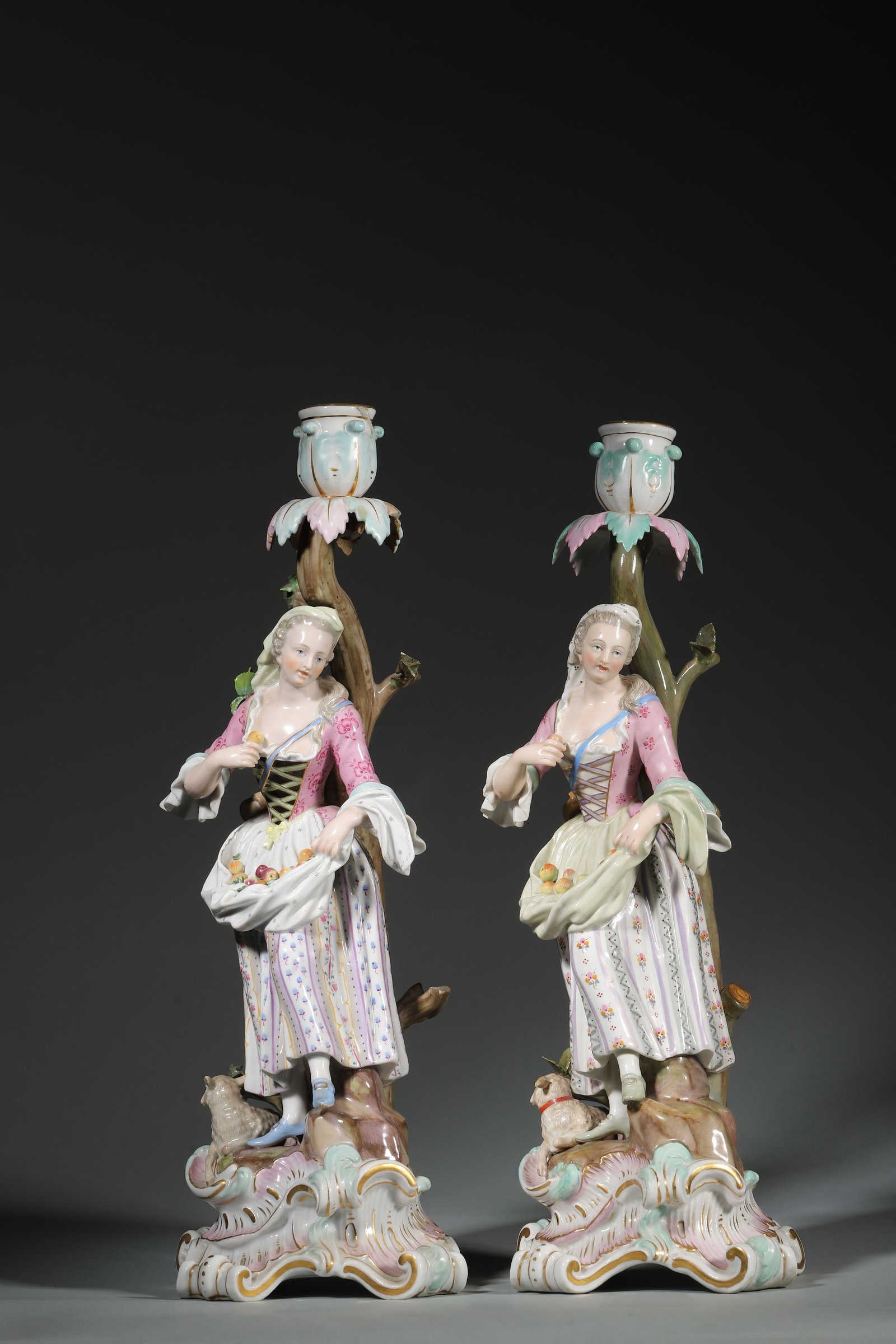German Meissen Designer Rococo Style Shepherdess Candelabrum: Diameter 13cm, Height 35.5cm (Diameter 5.12", Height 13.98")Designed and produced by model artist EA Leuteritz between 1863 and 1865. The piece depicts a shepherdess wearing an apron, holding fruit, l