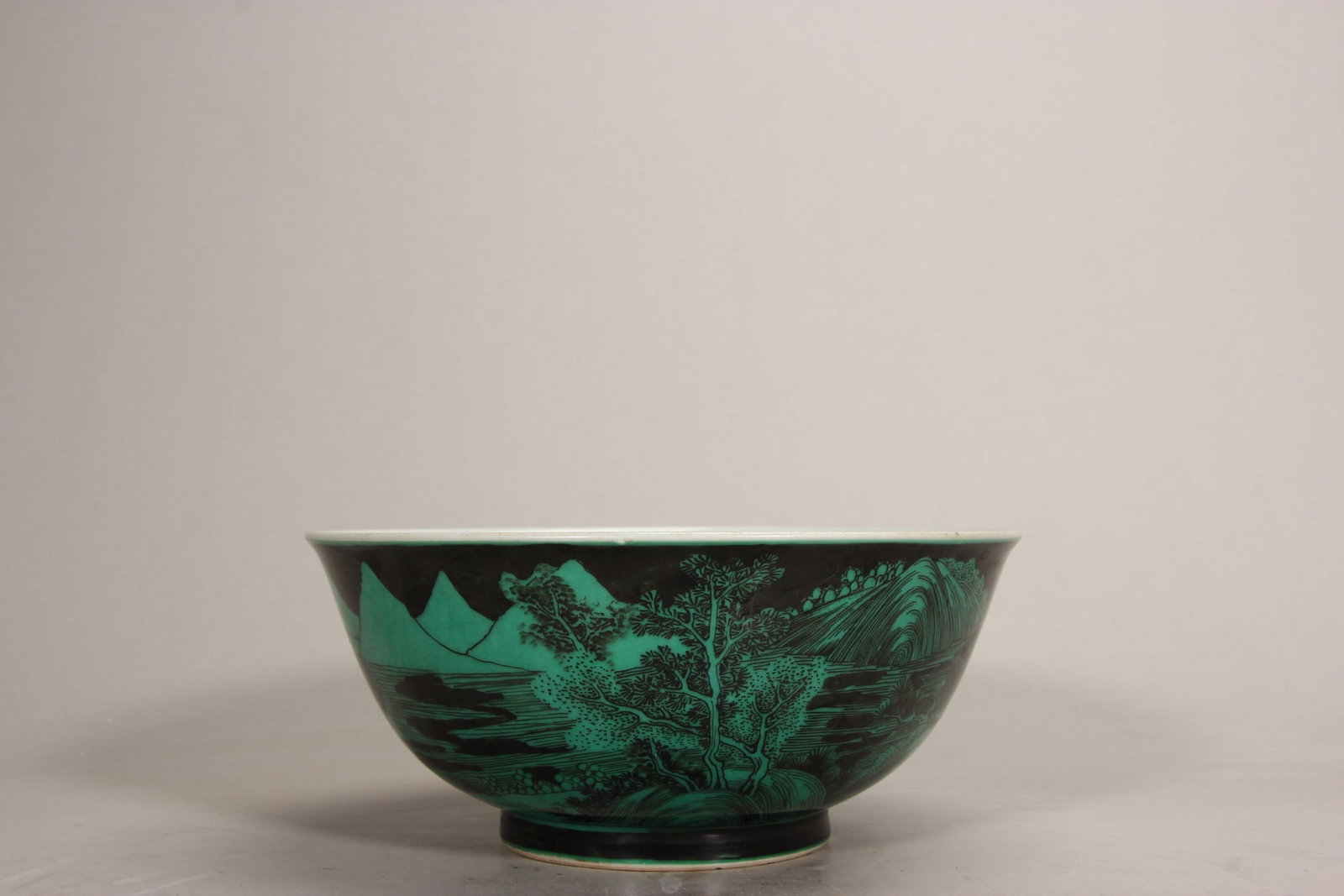QING YONGZHENG: BLACK-GROUND GREEN-ENAMEL LARGE BOWL WITH LANDSCAPE MOTIF: Height 8.5cm (Height 3.35") Caliber 19.7cm (Caliber 7.76")Yongzheng jar (Zhenghe mark): black base enamel landscape (ink-painting style) (rare black-ground enamel; "innovative craft" style). Extremely