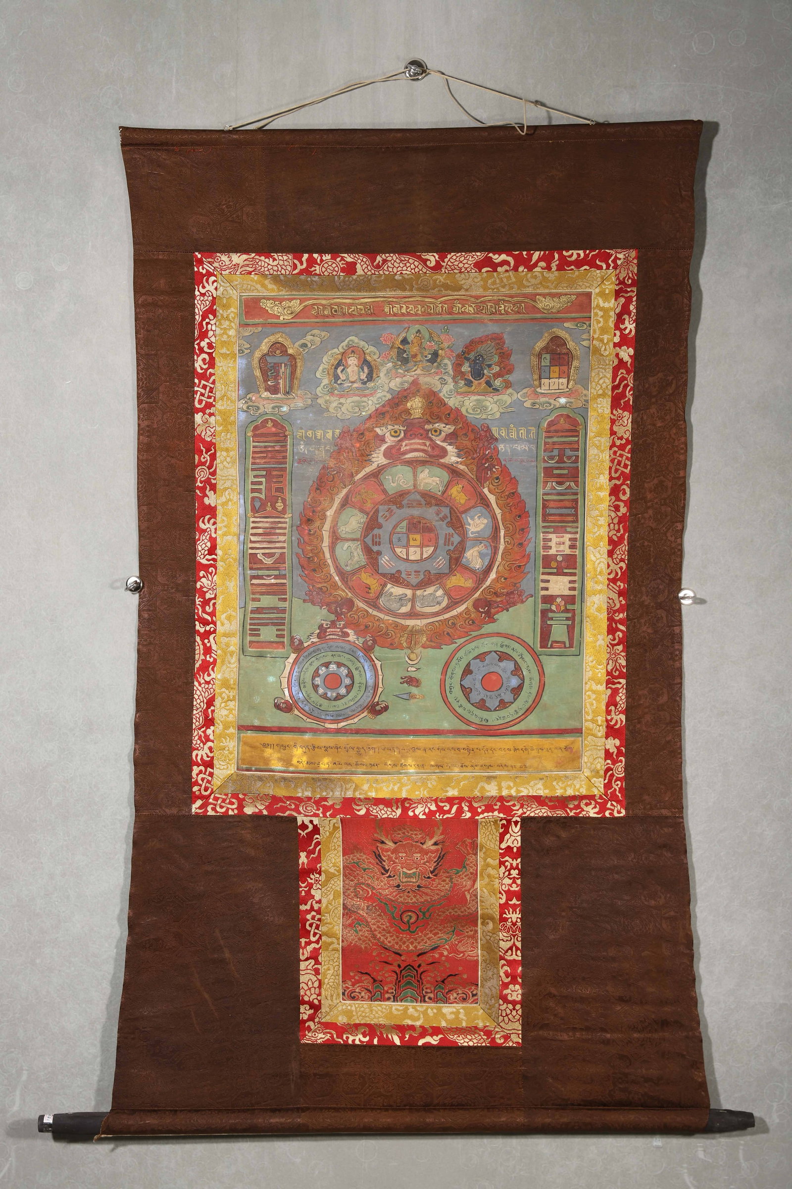 QING DYNASTY, A FINE TIBETAN THANGKA OF MANJUSHRI WITH THE NINE PALACES AND EIGHT TRIGRAMS (SPA: 26.77" x 19.29" inches (68.0 cm x 49.0 cm) (Main)This 18th–19th century Tibetan thangka is painted with mineral pigments on cloth, centered on the Nine Palaces and Eight Trigrams mandala, encircled