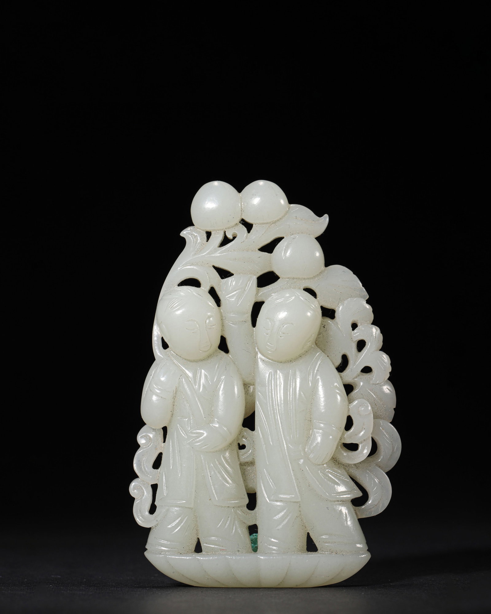 HETIAN WHITE JADE RETICULATED PENDANT OF TWO BOYS OFFERING LONGEVITY, MID-QING DYNASTY: 1.97" x 3.07" inches (5.0 cm x 7.8 cm) | Weight: 0.15 lbs (67.0 g)An auspicious pendant from the mid-Qing Dynasty, carved from Hetian white jade with two boys offering longevity peaches. The vivid