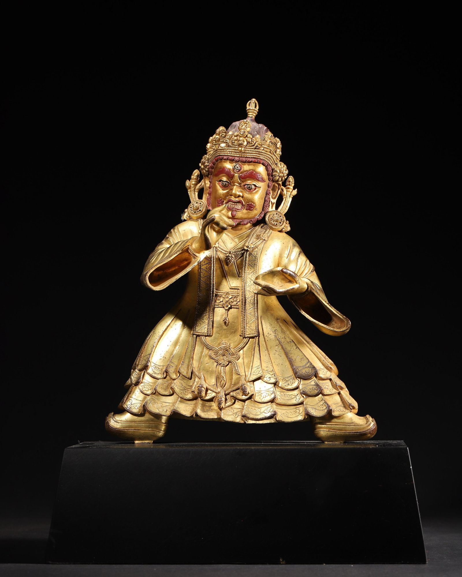 COMMISSIONED GILT-BRONZE FIGURE OF DAMCHEN CHOSKYONG, QING DYNASTY, QIANLONG PERIOD: 8.27" x 12.2" inches (21.0 cm x 31.0 cm) (Main) | Weight: 6.44 lbs (2919.0 g)A fine gilt-bronze figure of Damchen Choskyong, Qianlong period, Qing Dynasty. Exquisitely cast with rich gilding,