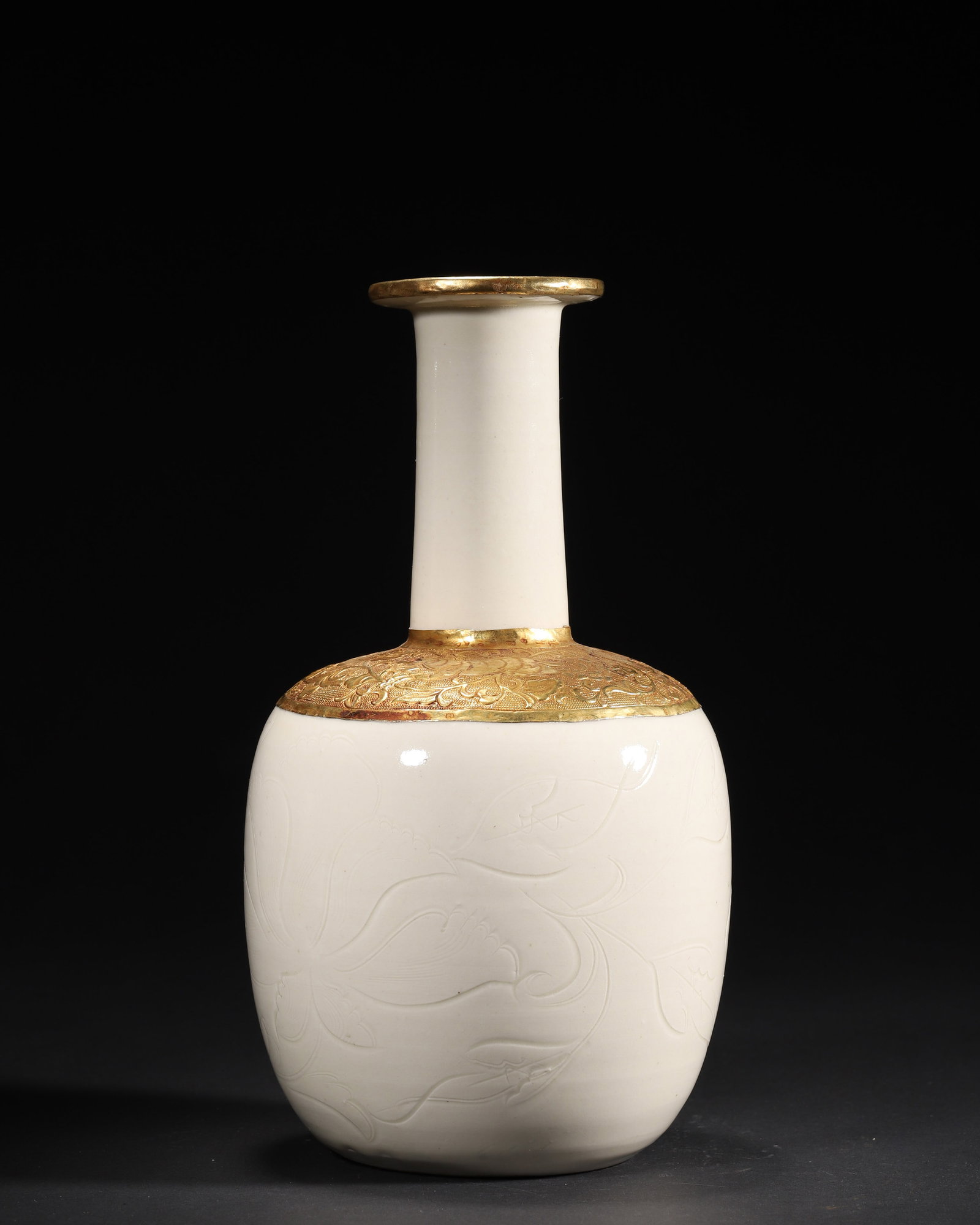 A FINE NORTHERN SONG DYNASTY (10TH–12TH CENTURY) DINGYAO WHITE-GLAZED LONG-NECKED VASE WITH: 5.12" x 9.84" inches (13.0 cm x 25.0 cm) (Main)This exquisite Northern Song Dingyao vase is covered in a lustrous ivory-white glaze, with delicate incised floral scrolls on the body. The gilt-metal