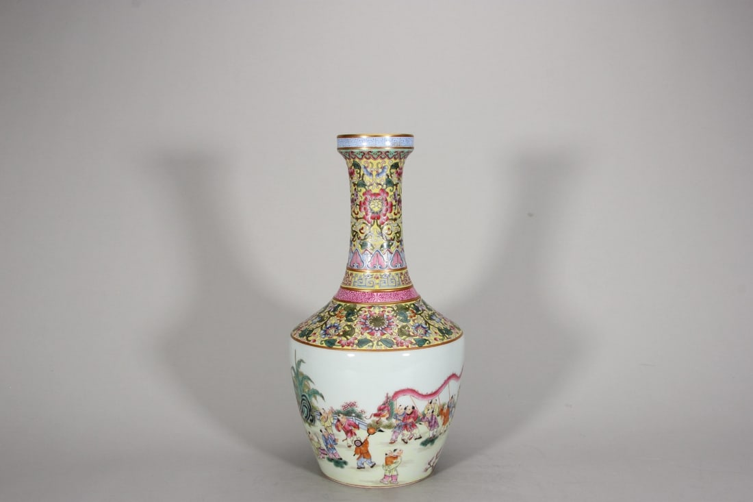 QING DYNASTY YONGZHENG PERIOD, FAMILLE ROSE LONG-NECKED VASE WITH CHILDREN AT PLAY PATTERNS: H: 13.11" (H:33.3cm)A fine Yongzheng period official kiln vase, with yellow-ground famille rose and 'Hundred Boys' scene. A masterpiece of Qing Dynasty porcelain art, embodying the peak of craftsmansh