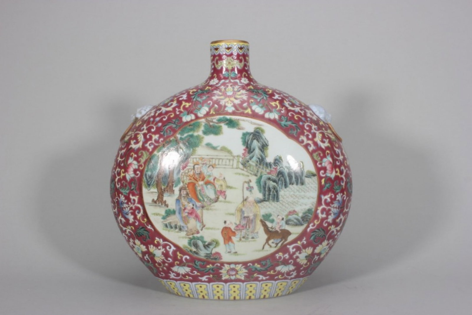 QING DYNASTY QIANLONG PERIOD, FAMILLE ROSE CARMINE-GROUND MOON-FLASK WITH RESERVED PANELS OF EIGHT (1 of 9)